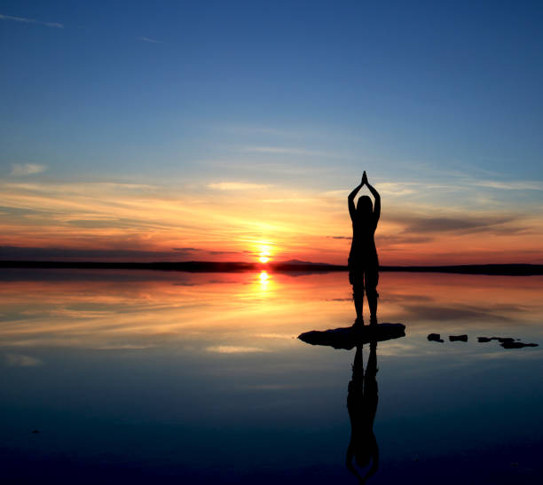 istock a women silhouette at sunset 1136876998