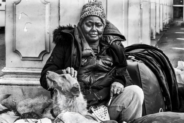 Sarajevo, Bosnia and Herzegovina - December 29, 2009: Detail from the main streets of Sarajevo Ferhadija, senior woman on newspaper stand in street, Sarajevo.