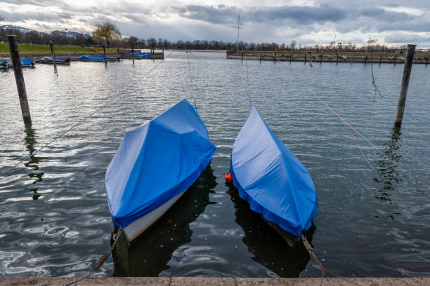 Two covered boats in a small harbour of Hard (Austria) on Lake Constance (Bodensee)
