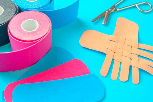 colored kinesiotapes with a pair of scissors