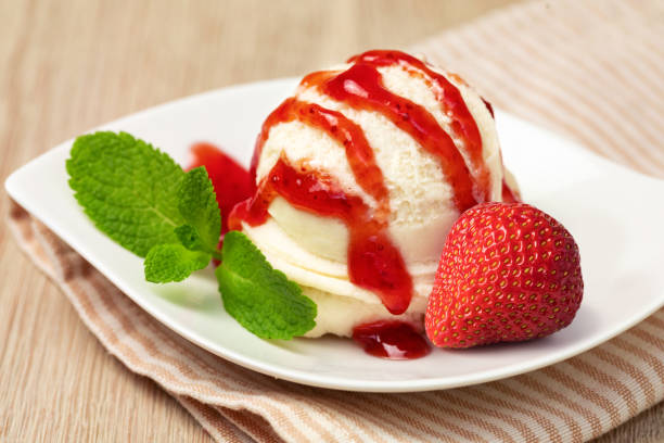 istock Bowl with tasty ice cream on table 1136879509