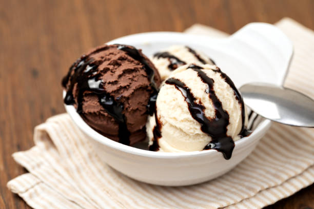 istock Bowl with tasty ice cream on table 1136879510