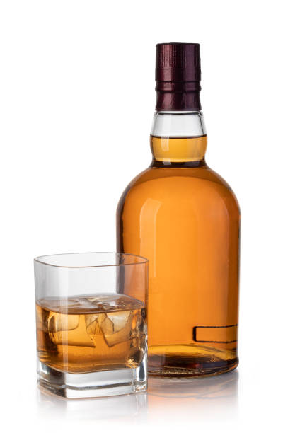 istock whiskey bottle and glass 1136883361