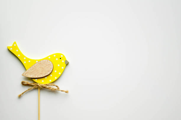 istock Handmade wooden crafts yellow bird topper 1136883646