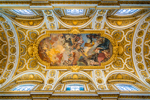 Gothic 14th-century church featuring ornate 18th-century decorative art on the vaulted ceiling.