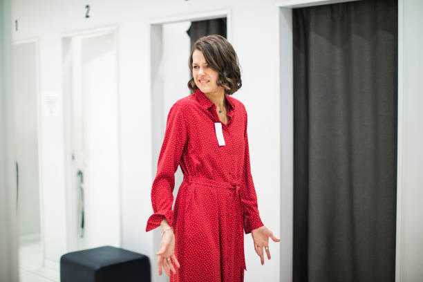 istock Woman in clothing store 1136885983