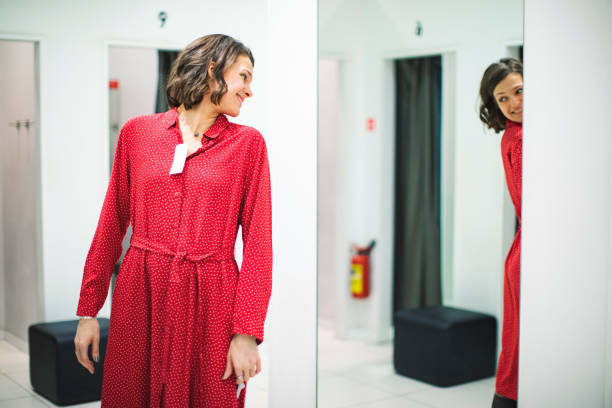 istock Woman in clothing store 1136885995