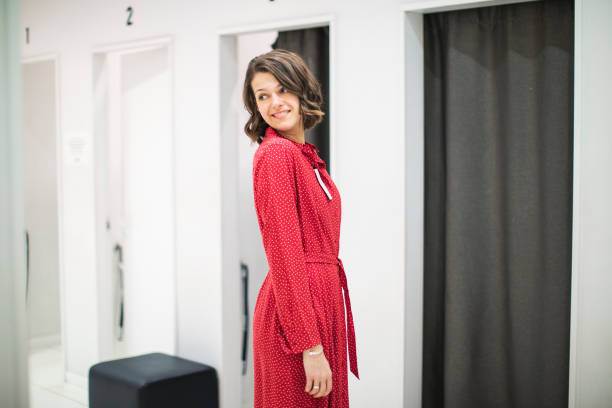istock Woman in clothing store 1136885996