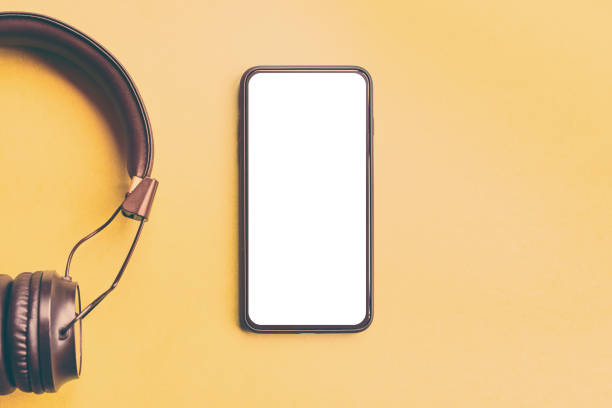 istock Headphones and smartphone on colorful background. 1136888446
