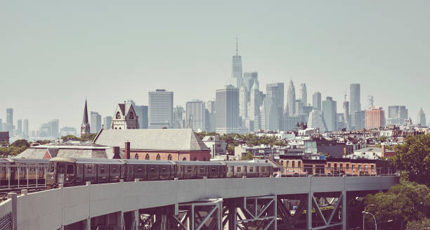 istock Subway train with New York City skyline, USA. 1136888824