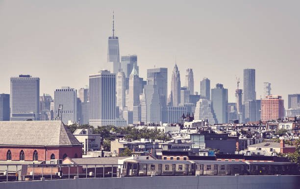 istock Subway train with New York City skyline, USA. 1136888887