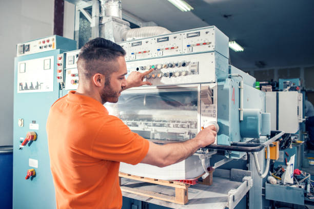 istock Workers in a printing factory 1136888943