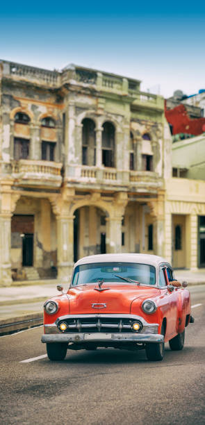 istock Vintage red oldtimer car driving through Old Havana Cuba 1136889198
