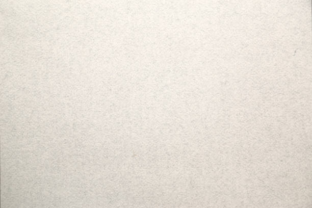 istock Light gray brown background with streaks and particles 1136889795
