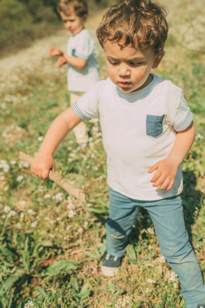 istock Brothers playing outdoors 1136890173