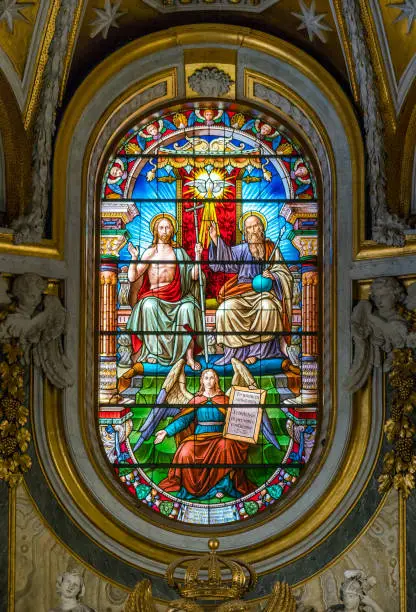 The Trinity in the stained glass of the Church of Santa Maria dell'Anima, in Rome, Italy.