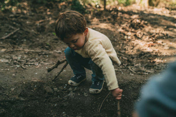 istock Brothers playing outdoors 1136890293