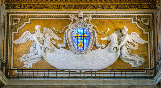 Counterfacade with angles supporting the Barberini emblem, designed by Bernini, in the Basilica of Santa Maria in Ara Coeli, Rome, Italy.