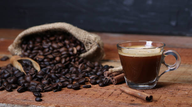 istock Coffee cup with Coffee beans, burlap sack and with cinnamon sticks 1136891898