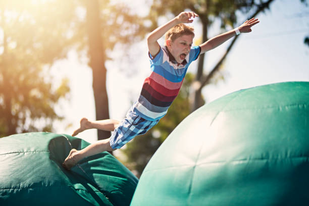 Little boy having fun on inflatable obstacle course Little boy having fun in inflatable bouncy castle playground. Sunny summer day
Nikon D810 Bounce House stock pictures, royalty-free photos & images