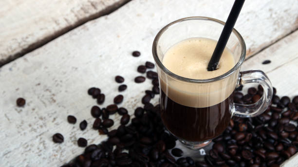 istock Irish coffee in glass on wooden table. 1136892153