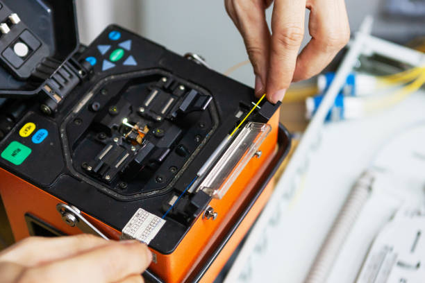 istock worker comunicate fiber optic cable at opto box. installing new network equipment. 1136892434