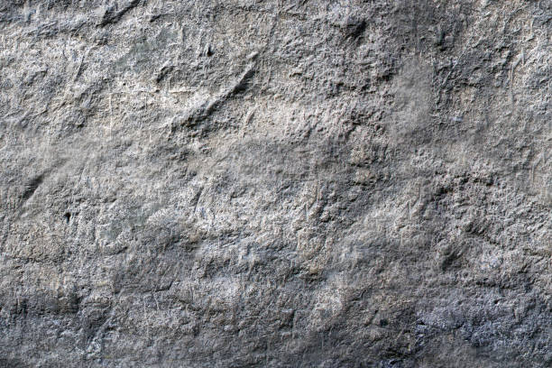 Gray stone textured wall in close-up view stock photo