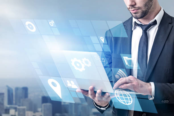 istock Man with laptop, business interface, city 1136895141