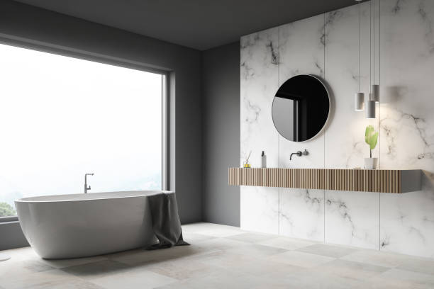 istock Gray and white marble bathroom corner, tub, sink 1136895315