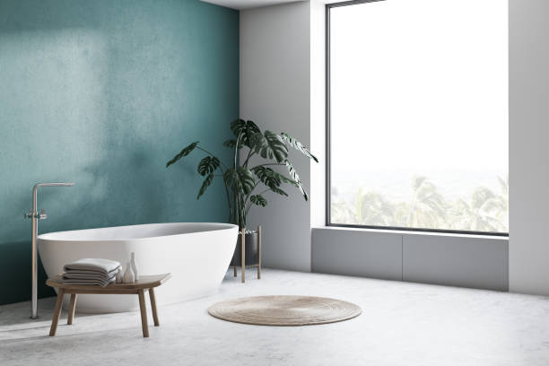 istock Green and white bathroom corner with tub 1136896038