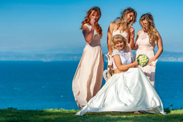 istock Smiling Bride Having Fun With Her Bridesmaids and Friends 1136896958
