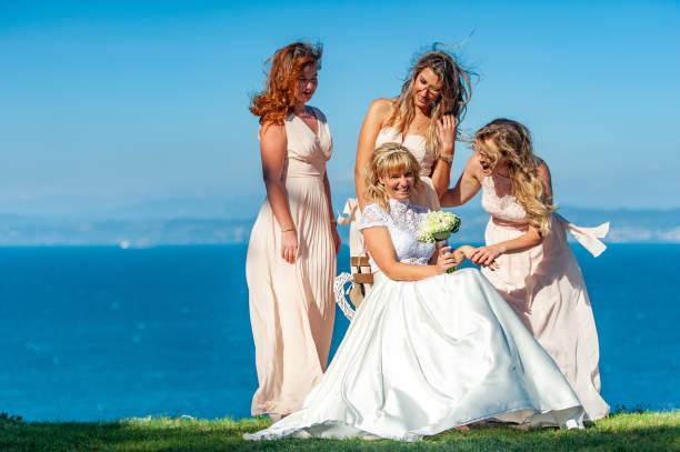 istock Bride Having Fun With Her Bridesmaid and Friends After Wedding 1136896963