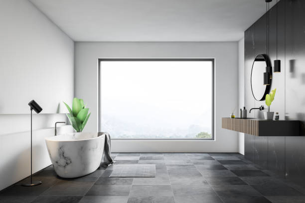 istock White bathroom interior with marble tub and sink 1136897024
