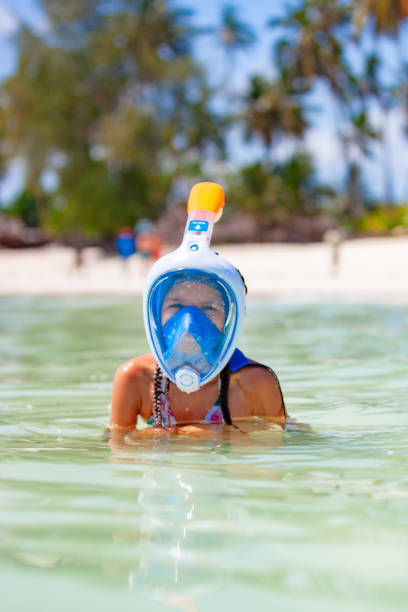 istock Young Girl With Scuba Mask Exploring on Tropical Vacations 1136897866