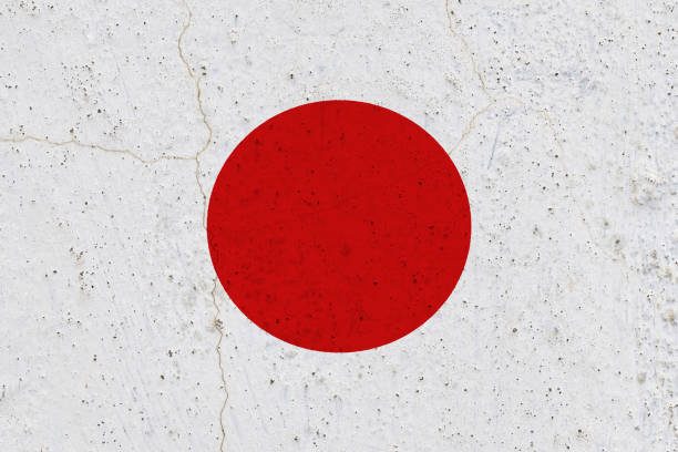 istock Japan flag on concrete wall 1136898104