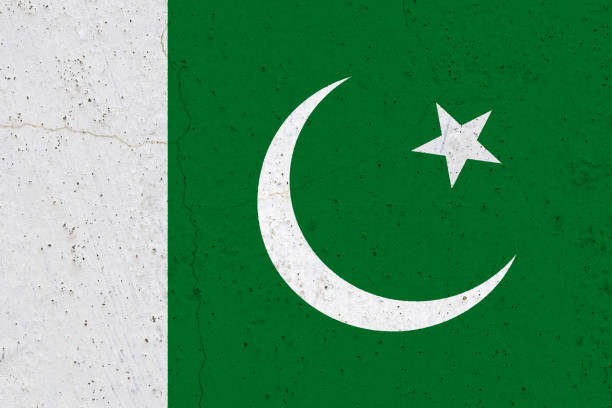 istock Pakistan flag on concrete wall 1136898138