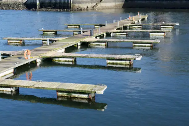 Pontoon wooden jetty pier for boat mooring marina at sea uk
