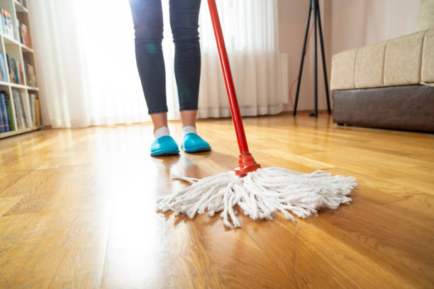 istock Maid wiping floor 1136901981