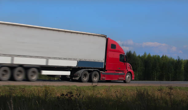 istock truck moves on highway 1136902927