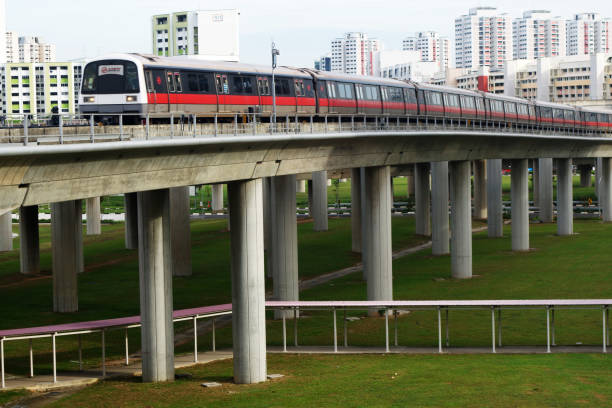 Singapore mass rapid train (MRT) travels on the track in Jurong East, Singapore Singapore - Jul 17, 2015: Singapore mass rapid train (MRT) travels on the track in Jurong East, Singapore on 17 July, 2015. The MRT has 106 stations and is the second-oldest metro system in Southeast Asia, after Manila's LRT. singapore mrt stock pictures, royalty-free photos & images