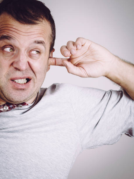 istock Man can't sleep because of noise 1136908793
