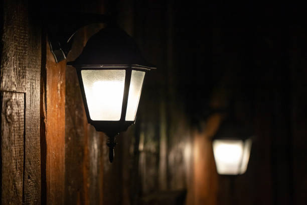 istock old style small lanterns on a wooden wall 1136909902