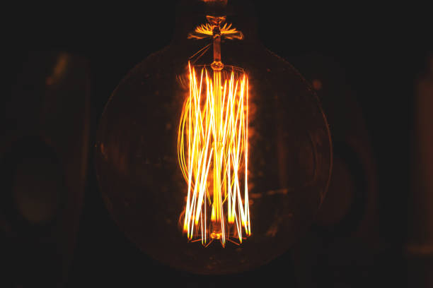 istock Edison incandescent bulb with a large bulb, retro toned 1136909914
