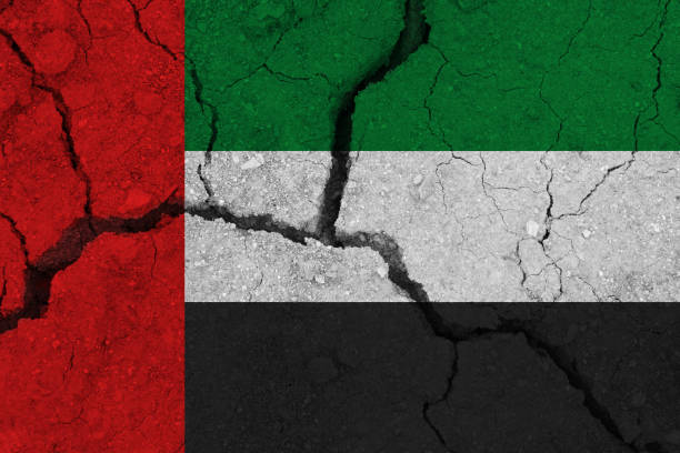 istock united arab flag on the cracked earth 1136916446