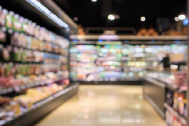 istock Abstract supermarket aisle interior blurred defocused background with bokeh light 1136917490