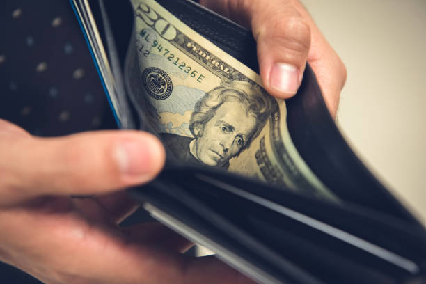 istock A man opening wallet looking for some money 1136917682