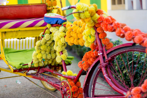 istock cycle rickshaw covered with multicolored flowers for a wedding in india 1136917771