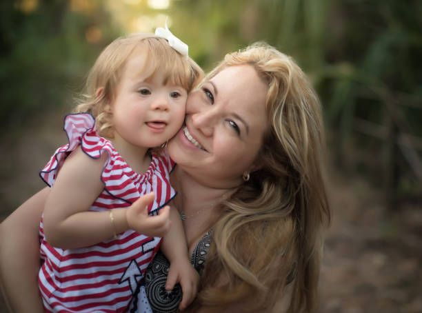 istock One year old girl having fun in the park 1136920830