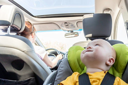 Happy Baby Boy Secure in Baby Car Seat