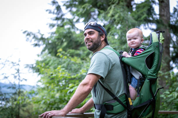 istock Father Backpacking Hiking with Baby in Forest 1136924702